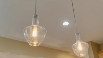 Two glass pendant lights hanging from the ceiling