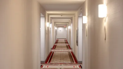 Hotel hallway with sconce lighting on the walls