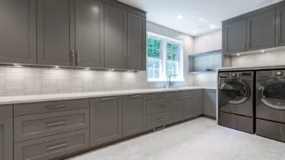 Lights under cabinets in a laundry room.